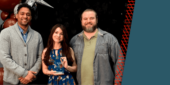 members of the beaverbird team stand with a trophy they earned